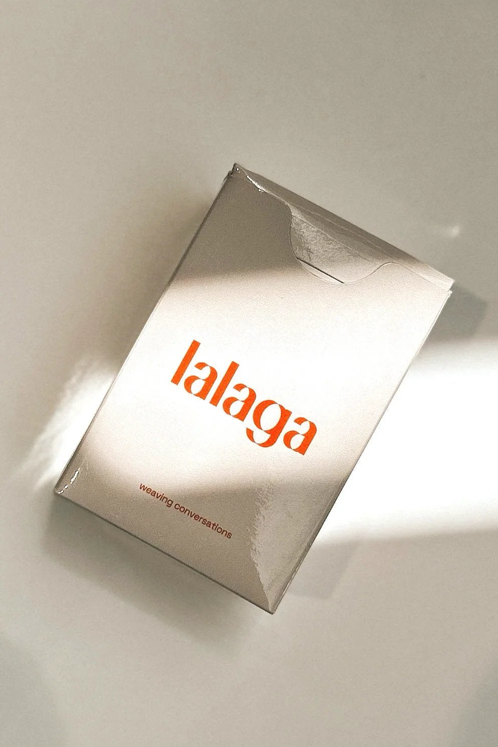 Lalaga card game box on white linen